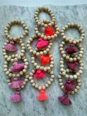 Collection of 13 toddler / little girls wood and tassel stretch bracelets